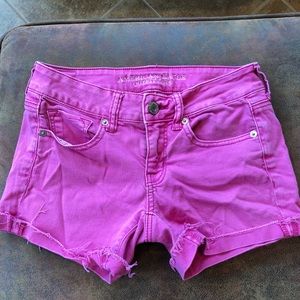 Pink-wash jean shorts , folded on the bottom
